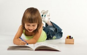 Cute little girl with drawing book